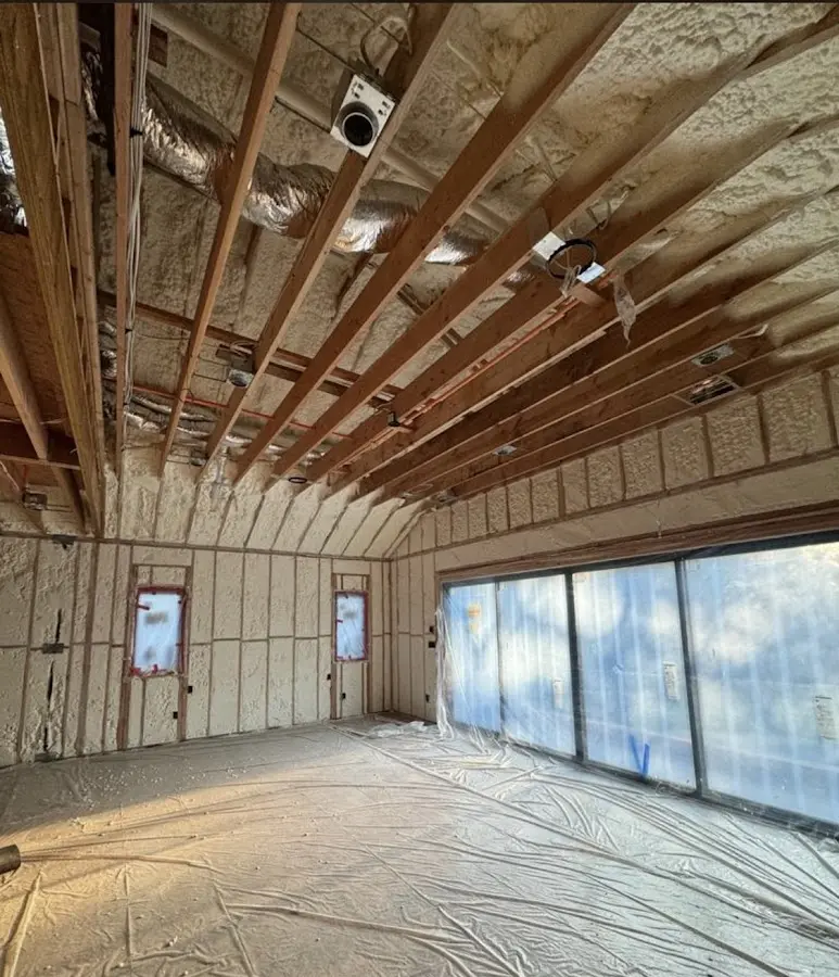 Interior walls and ceiling insulated with spray foam during new construction in Oconomowoc